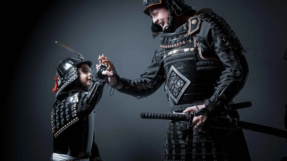 Guest wearing authentic Marutake samurai armor during a samurai Kyoto photoshoot experience, Kyoto, Japan